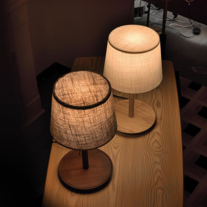 Gentle Glow lamp made of Nordic walnut wood with luxurious fabric accents