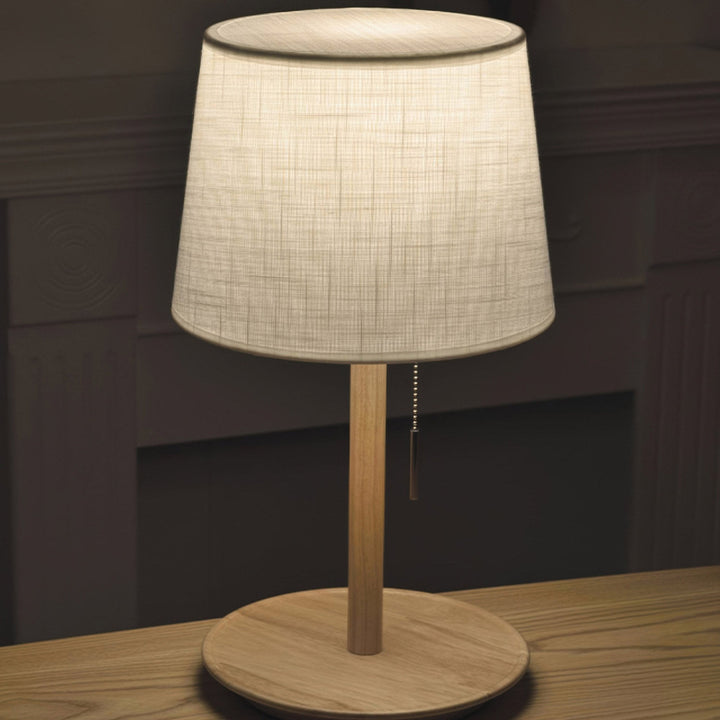 Gentle Glow lamp made of Nordic walnut wood with luxurious fabric accents
